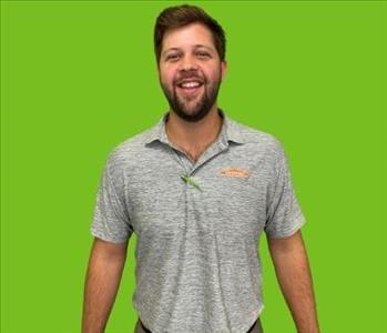 SERVPRO employee on green background