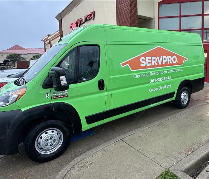 Green Van in Parking Lot